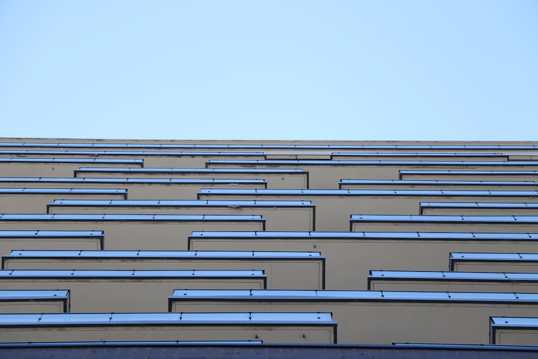 white concrete building under white sky during daytime