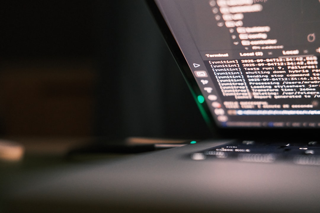 Laptop screen displaying lines of code