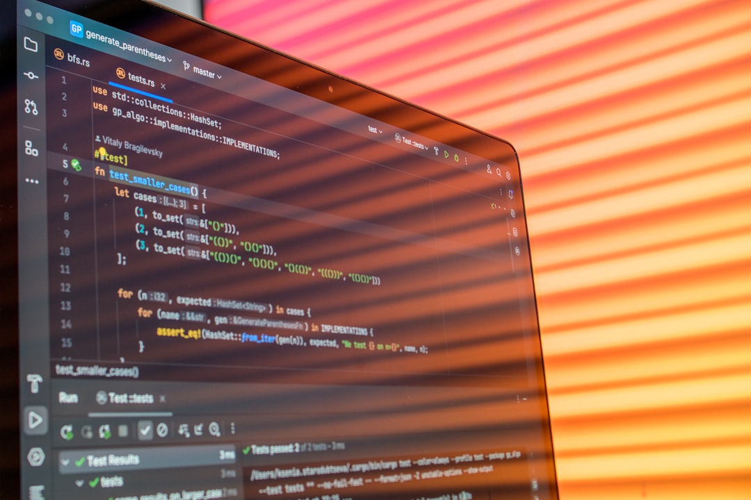 Laptop screen displaying code with colorful background